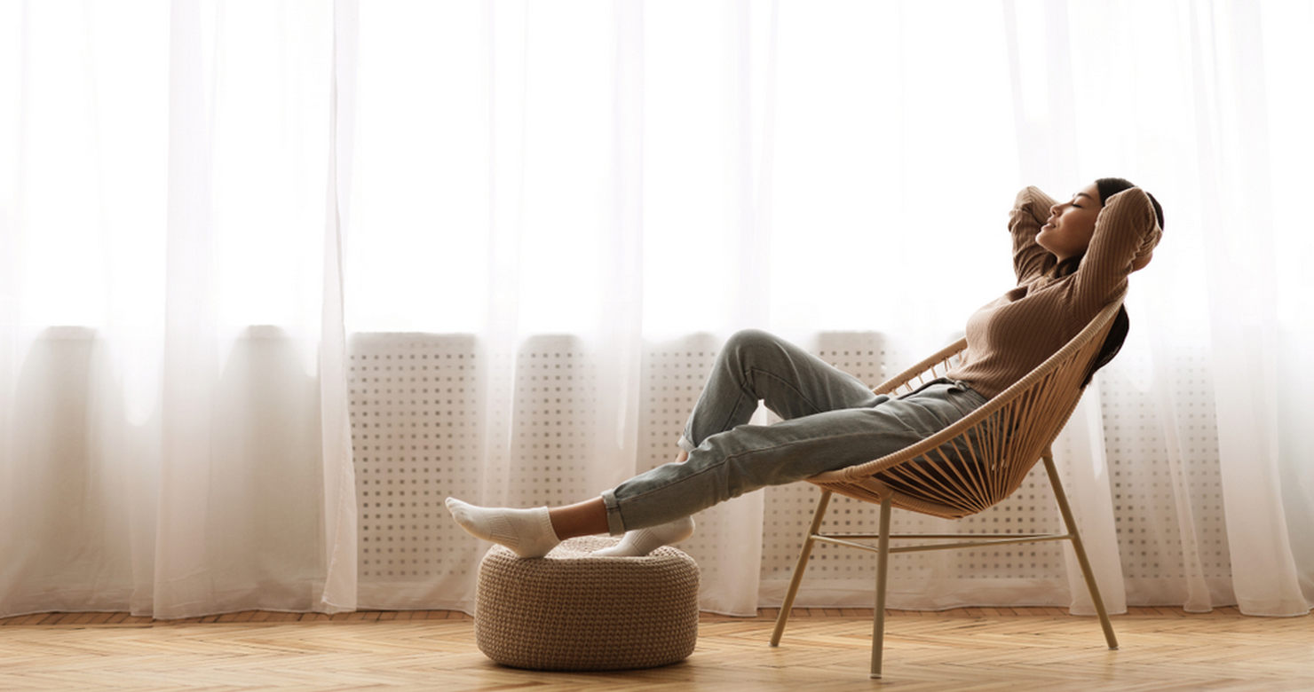 Lady enjoying quiet home with new windows