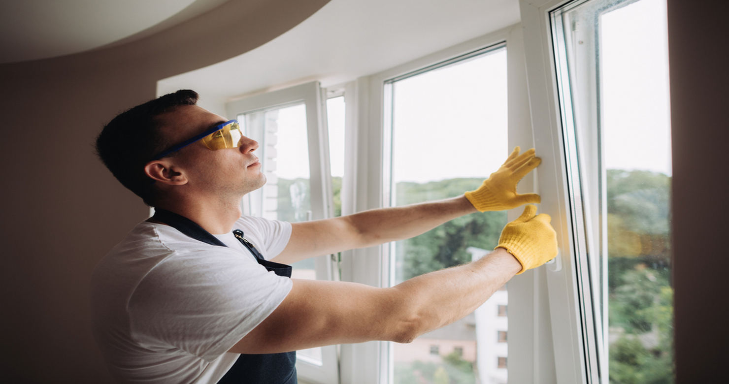 Man installing Jeld Wen Windows - ﻿All About Jeld-Wen Wood and Clad-Wood Windows